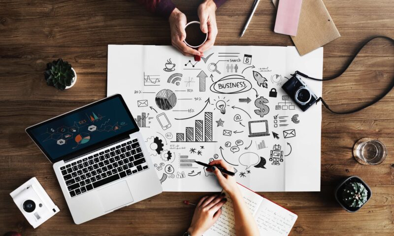 Person working on laptop with coffee